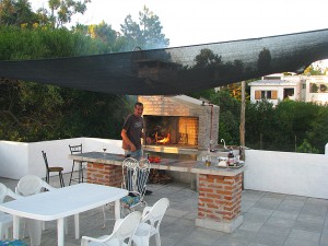 Our friend Estaban firing up the parrilla on our roof-top deck.